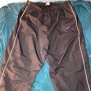 Nike track pants front and back pockets streetwear